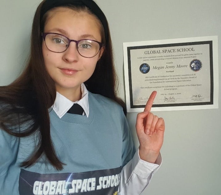 Cadet pointing to space school certificate