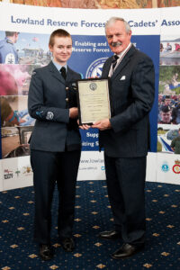 Air Cadet receiving certificate from Lord Lieutenant  