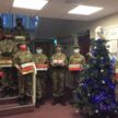 Cadets holding Christmas presents