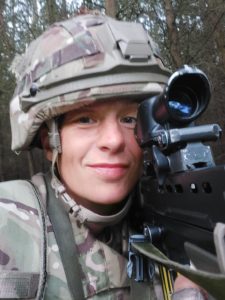Army Reservist Kerry holding gun