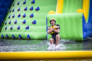 Sense of fun: Cadets taking on a water course at their summer camp