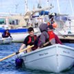 Sea Cadets rowing on sea