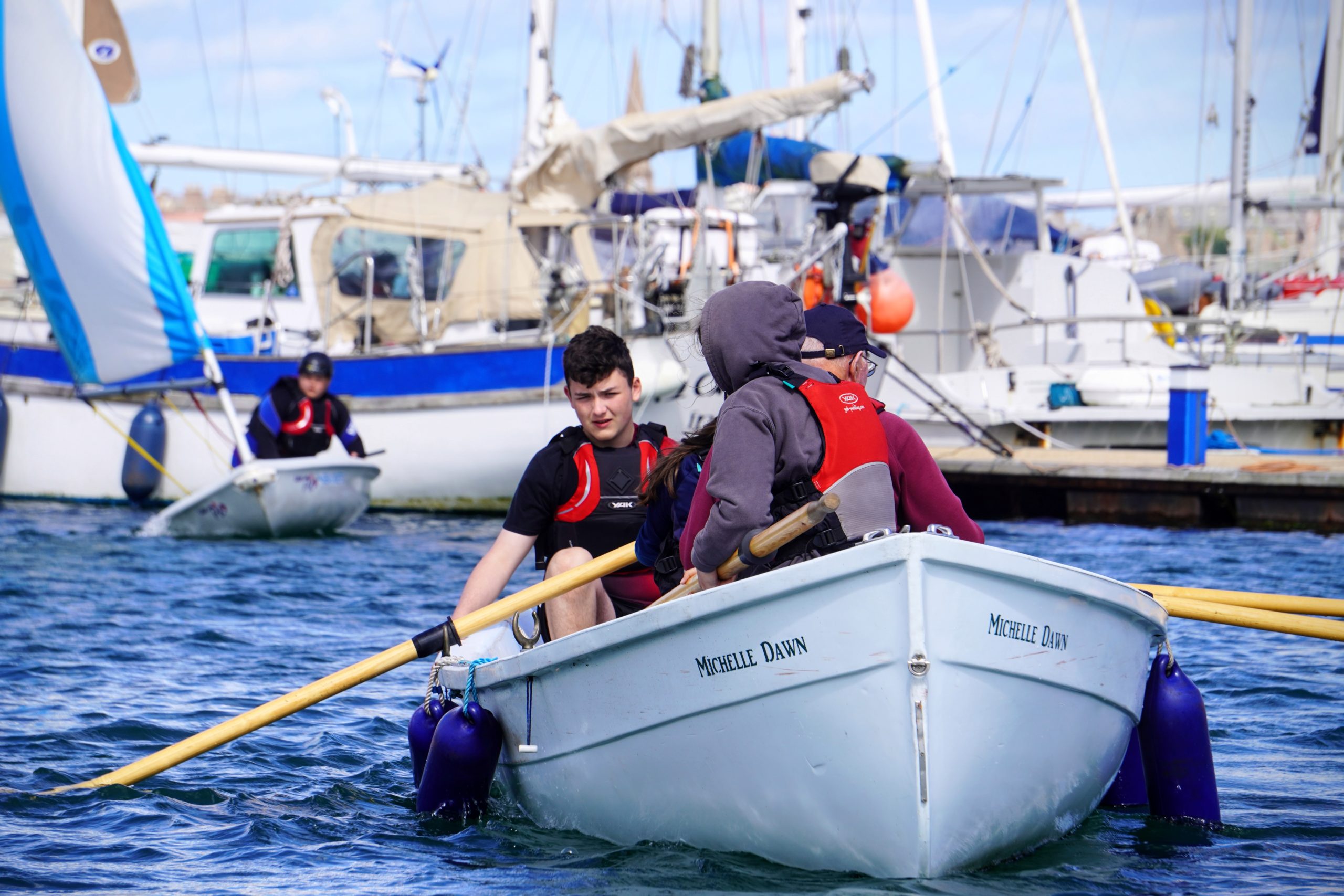 Sea Cadets rowing on sea
