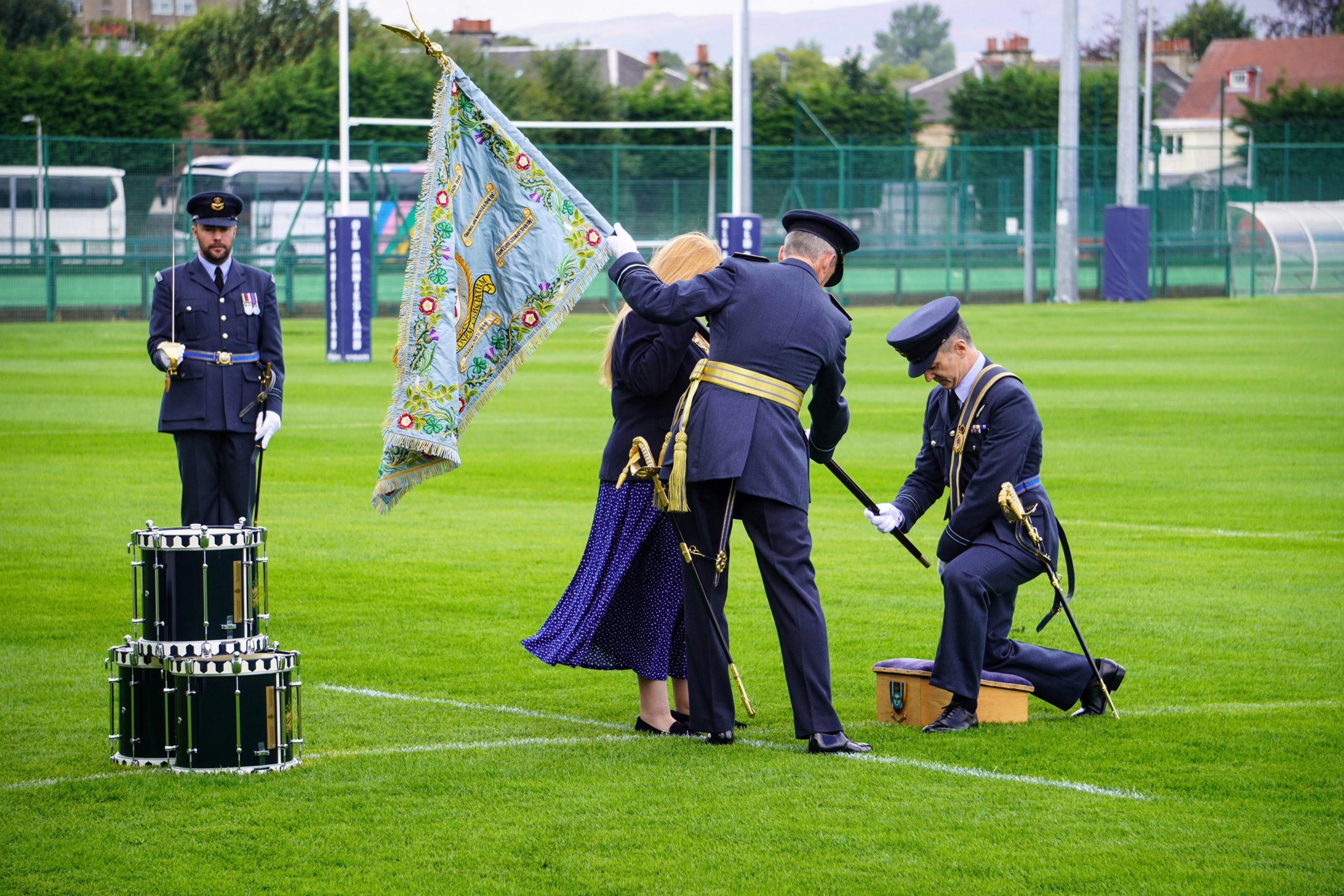 Members of RAF Reserves kneel to receive Colours