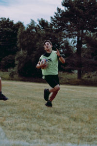 Cadet runs with a rugby ball