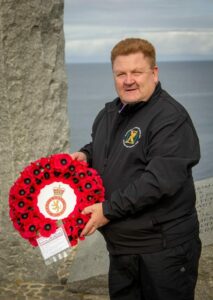 Commandant Col Derek Coulter laying a poppy wreath