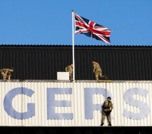 Members of the Royal Marines abseiling from the Sandy Jardine Stand before the match on Saturday