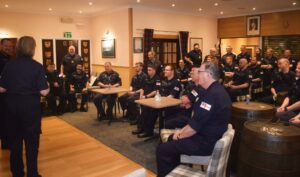 The Ship's Company of HMS Dalriada sitting down for a fireside chat with the Commander Maritime Reserves