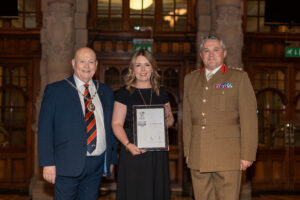North Lanarkshire Council representatives standing beside Commander 51 Brigade Brigadier Jody Davies with their Silver ERS Award