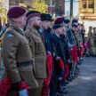 A line of present and past servicemen line up to lay their wreaths at the Cenotaph in Glasgow's George Square