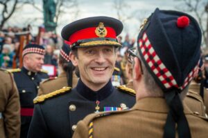 General Officer Scotland Major General Robin Lindsay CBE speaking with a Reservist from 215 Scottish Multirole Medical Regiment.