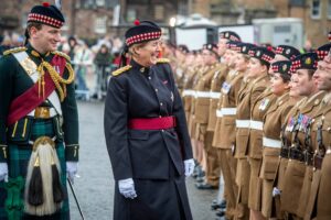 Dame Katherine Grainger DBE sharing a humorous moment with Reservists from 215 Scottish Multirole Medical Regiment at the Formation Parade.