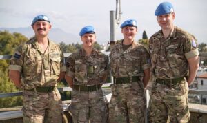 Four Reservists in blue UN berets standing on the rooftop of Ledra Palace Hotel, Nicosia.