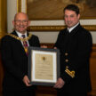Councillor Robert Aldridge, left, presenting a Lord-Lieutenant's Certificate to Lieutenant Iain MacIver of East Scotland University Royal Naval Unit.