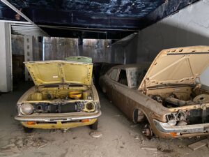 An abandoned car showroom in the Central AO, filled with cars that were newly imported in the 1970s.