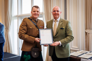 Ralph Porciani receive certificate from Lieutenant Colonel Lee Carson