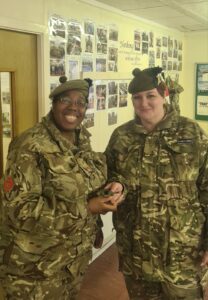 Second Lieutenant D'Arcy Greig is congratulated on her promotion by Officer Commanding Major Yasmin Shorter