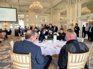 golfers sit down to lunch in the ballroom