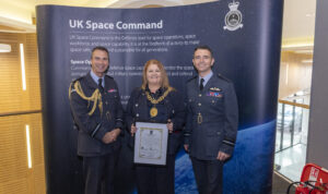 Lord Provost of the City of Glasgow Jacqueline McLaren stands between two RAF Reserve personnel at the 602 Squadron Space unit formation ceremony.
